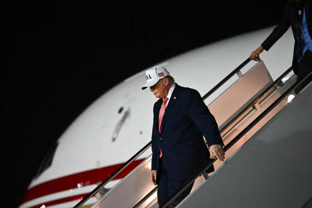 US President Donald Trump disembarks Air Force One at Pitt-Greenville Airport in Greenville, North Carolina, on October 20, 2026. (Photo by Kent NISHIMURA / AFP)