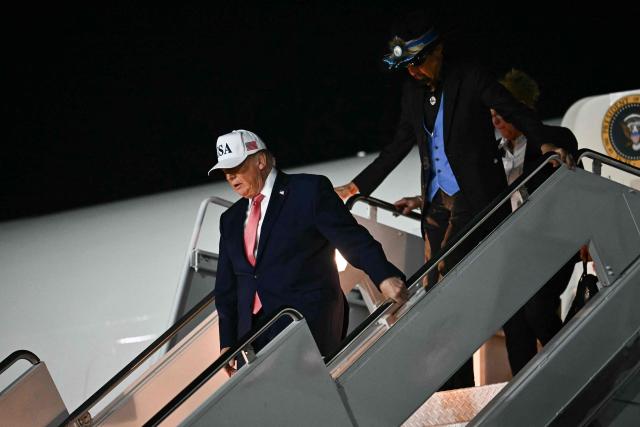 US President Donald Trump and US race car driver Richard Petty disembark from Air Force One at Pitt-Greenville Airport in Greenville, North Carolina, on October 20, 2026. (Photo by Kent NISHIMURA / AFP)