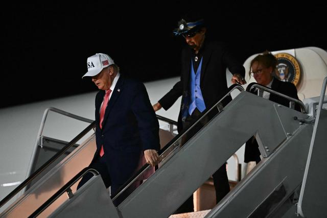 US President Donald Trump and US race car driver Richard Petty disembark from Air Force One at Pitt-Greenville Airport in Greenville, North Carolina, on October 20, 2026. (Photo by Kent NISHIMURA / AFP)