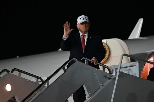 US President Donald Trump disembarks Air Force One at Pitt-Greenville Airport in Greenville, North Carolina, on October 20, 2026. (Photo by Kent NISHIMURA / AFP)