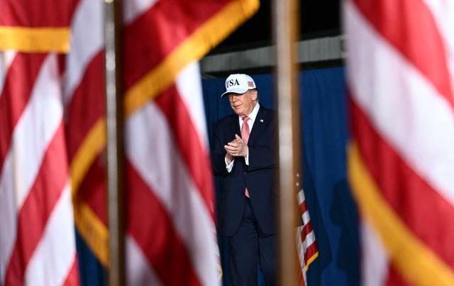 US President Donald Trump arrives to speak at a midterm campaign rally at Pitt-Greenville Airport in Greenville, North Carolina, on October 20, 2026. (Photo by Kent NISHIMURA / AFP)