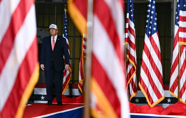 US President Donald Trump arrives to speak at a midterm campaign rally at Pitt-Greenville Airport in Greenville, North Carolina, on October 20, 2026. (Photo by Kent NISHIMURA / AFP)