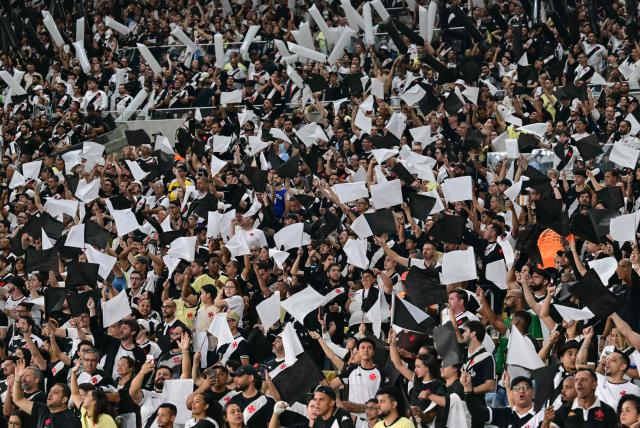 Vasco da Gama supporters cheer for their team ahead of the Copa Sudamericana semifinal second leg football match between Brazil's Vasco da Gama and Argentina's Boca Juniors at the Maracana stadium in Rio de Janeiro, Brazil, on October 20, 2026. (Photo by Pablo PORCIUNCULA / AFP)