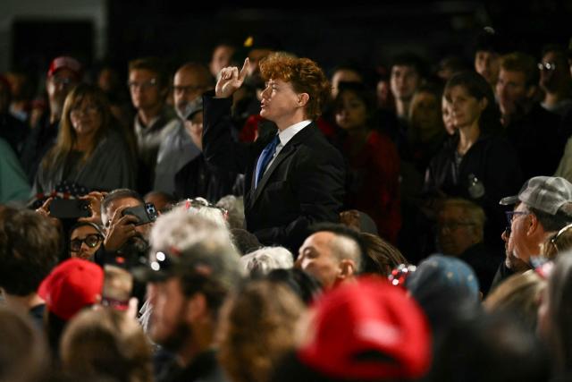 A protestor shouts as US President Donald Trump speaks at a midterm campaign rally at Pitt-Greenville Airport in Greenville, North Carolina, on October 20, 2026. (Photo by Kent NISHIMURA / AFP)