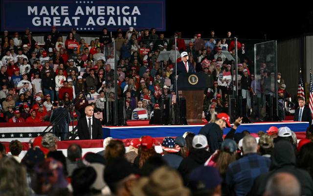 US President Donald Trump speaks at a midterm campaign rally at Pitt-Greenville Airport in Greenville, North Carolina, on October 20, 2026. (Photo by Kent NISHIMURA / AFP)