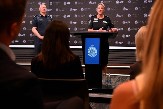 Commissioner of the Australian Federal Police Krissy Barrett (R) speaks alongside Chief Commissioner of Victoria Police, Mike Bush (L) during a press conference for an update on the attack on Australian politician Helen Haines, in Melbourne on October 21, 2026. The man alleged to have critically wounded Australian lawmaker Helen Haines in a "targeted" attack appeared in court on October 21, as police warned that growing extremism online was fuelling political polarisation. (Photo by William WEST / AFP)
