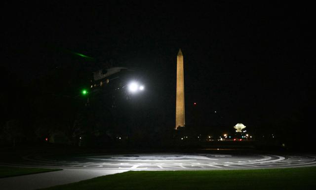 Marine One with US President Donald Trump on board, lands on the South Lawn of the White House in Washington, DC, on October 20, 2026. President Trump is returning from campaigning in North Carolina. (Photo by Jim WATSON / AFP)