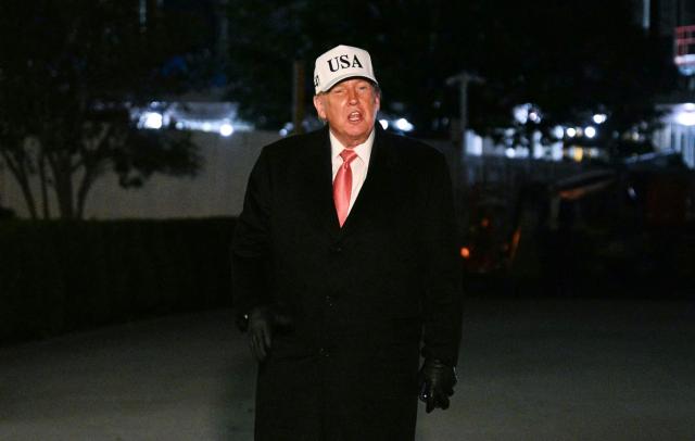 US President Donald Trump speaks to reporters on the South Lawn upon arrival at the White House in Washington, DC, on October 20, 2026. President Trump is returning from campaigning in North Carolina. (Photo by Jim WATSON / AFP)