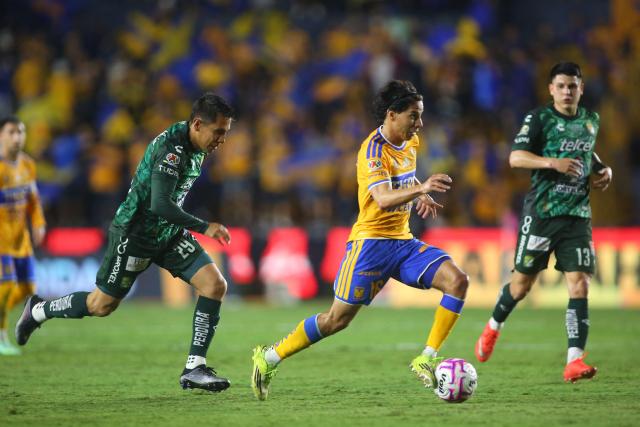 Leon's midfielder #29 Jose Rodriguez and Tigres' midfielder #16 Diego Lainez fight for the ball during the Liga MX Apertura tournament football match between Tigres and Leon at the Universitario de la UANL stadium in Monterrey, Nuevo Leon state, Mexico, on October 20, 2026. (Photo by Julio Cesar AGUILAR / AFP)