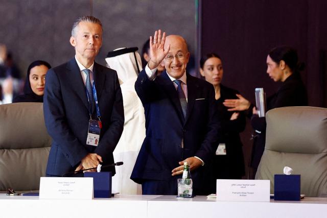 Amundi Middle East CEO Jerome Perrier (L) and Francois-Aissa Touazi, a member of the Executive Committee at Ardian, attend the 9th Annual One Planet Sovereign Wealth Funds (OPSWF) Summit at the Rosewood Hotel in Lusail on October 21, 2026. The French president is undertaking a tour of key energy suppliers in the Gulf in an effort to secure oil and diesel and bring down prices in France. (Photo by Benoit Tessier / POOL / AFP)