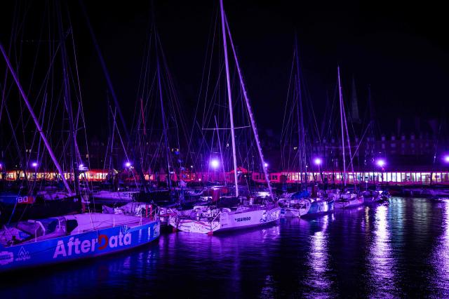 This photograph shows boats docked at night in the harbour of Saint-Malo, western France on October 20, 2026, a few days before the start of the 13th Route du Rhum Destination Guadeloupe. From Saint-Malo in Brittany to Pointe-a-Pitre in Guadeloupe, over 100 skippers across 6 classes will take the start on November 1, 2026, in this solo transatlantic sailing race. (Photo by Martin BUREAU / AFP)