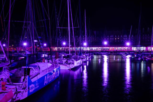 This photograph shows boats docked at night in the harbour of Saint-Malo, western France on October 20, 2026, a few days before the start of the 13th Route du Rhum Destination Guadeloupe. From Saint-Malo in Brittany to Pointe-a-Pitre in Guadeloupe, over 100 skippers across 6 classes will take the start on November 1, 2026, in this solo transatlantic sailing race. (Photo by Martin BUREAU / AFP)