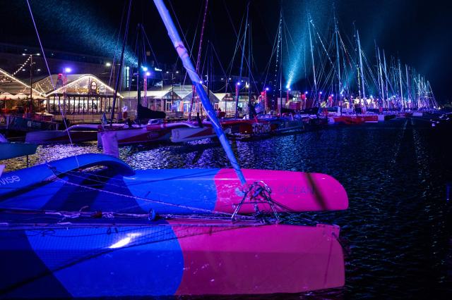 This photograph shows boats docked at night in the harbour of Saint-Malo, western France on October 20, 2026, a few days before the start of the 13th Route du Rhum Destination Guadeloupe. From Saint-Malo in Brittany to Pointe-a-Pitre in Guadeloupe, over 100 skippers across 6 classes will take the start on November 1, 2026, in this solo transatlantic sailing race. (Photo by Martin BUREAU / AFP)