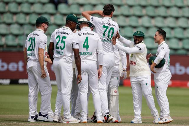 South Africa's Marco Jansen (3rd R) celebrates with teammates after dismissing Australia's Travis Head on day four of the second Test match between South Africa and Australia at St Georges Park in Gqeberha on October 21, 2026. (Photo by Marco Longari / AFP)
