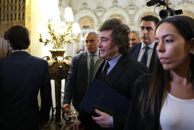 Argentinian President Javier Milei arrives to take part in an economic forum in Madrid on October 21, 2026. (Photo by Thomas COEX / AFP)