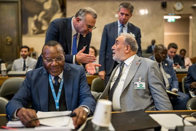 US Senior advisor for Arab and African Affairs Massad Boulos (TOP-L) speaks with Turkey Deputy foreign minister Musa Kulaklikaya (R) prior to the opening of the sixth Consultative Meeting on Enhancing Coordination of Peace Initiatives and Efforts in Sudan, in Geneva on October 21, 2026. (Photo by Fabrice Coffrini / POOL / AFP)