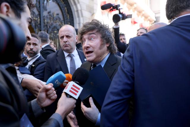 Argentinian President Javier Milei talks to media after taking part in an economic forum in Madrid on October 21, 2026. Milei's visit comes less than six weeks before Spain's tightly fought legislative elections on November 29. He is set to meet leaders of the far-right party Vox, as well as the right-wing leader of the Madrid region. (Photo by Thomas COEX / AFP)