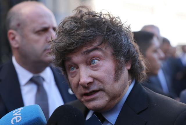 Argentinian President Javier Milei talks to media after taking part in an economic forum in Madrid on October 21, 2026. Milei's visit comes less than six weeks before Spain's tightly fought legislative elections on November 29. He is set to meet leaders of the far-right party Vox, as well as the right-wing leader of the Madrid region. (Photo by Thomas COEX / AFP)