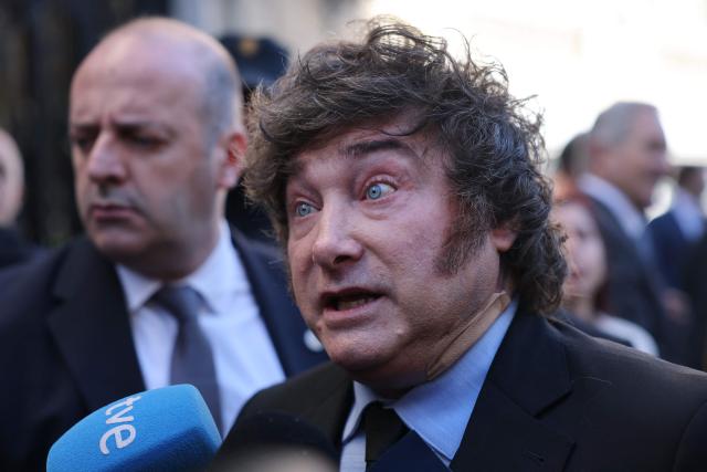 Argentinian President Javier Milei talks to media after taking part in an economic forum in Madrid on October 21, 2026. Milei's visit comes less than six weeks before Spain's tightly fought legislative elections on November 29. He is set to meet leaders of the far-right party Vox, as well as the right-wing leader of the Madrid region. (Photo by Thomas COEX / AFP)