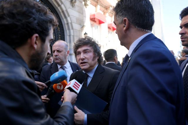Argentinian President Javier Milei talks to media after taking part in an economic forum in Madrid on October 21, 2026. Milei's visit comes less than six weeks before Spain's tightly fought legislative elections on November 29. He is set to meet leaders of the far-right party Vox, as well as the right-wing leader of the Madrid region. (Photo by Thomas COEX / AFP)