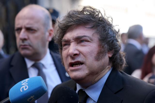 Argentinian President Javier Milei talks to media after taking part in an economic forum in Madrid on October 21, 2026. Milei's visit comes less than six weeks before Spain's tightly fought legislative elections on November 29. He is set to meet leaders of the far-right party Vox, as well as the right-wing leader of the Madrid region. (Photo by Thomas COEX / AFP)