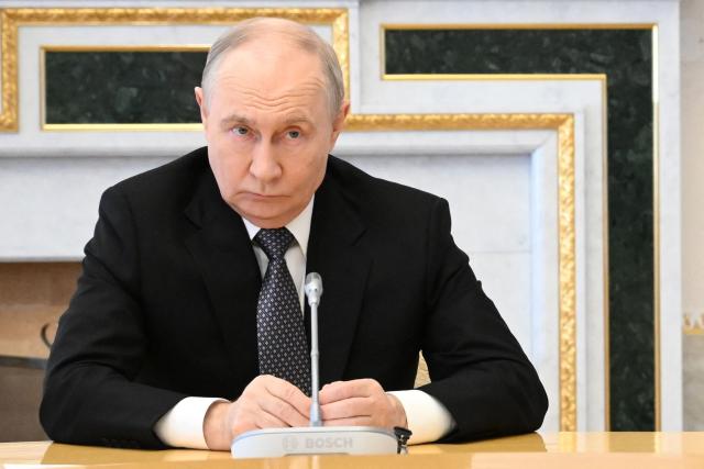 In this pool photograph distributed by the Russian state agency Sputnik, Russia's President Vladimir Putin attends a meeting with US special envoy in Saint Petersburg on October 21, 2026. (Photo by Kristina Solovyova / POOL / AFP) / Editor's note: This image is distributed by the Russian state owned agency Sputnik
