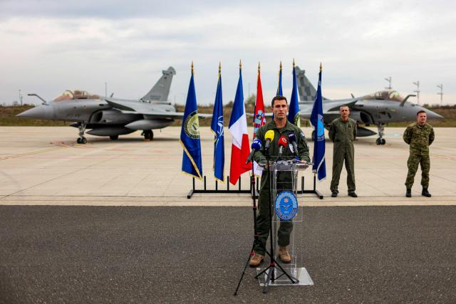 Major Nicolas of the French Air and Space Force addresses the media in front of Croatian and French Rafale fighter aircraft during joint training at Zagreb Air Base in Pleso, near Zagreb on October 21, 2026. The training is part of FRA-ACE 26 (French Agile Combat Employment), marking the first deployment to Croatia of Rafale aircraft from France's 5th Fighter Wing and focusing on rapid deployment and operations with a reduced logistical footprint. Croatian Rafale pilots and aircraft technicians from the 91st Wing are also training alongside their French counterparts, exchanging operational and technical experience. (Photo by Goran Stanzl / AFP)