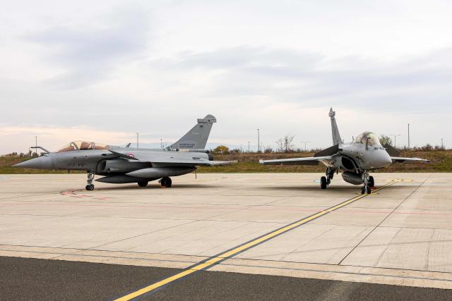 This photograph shows Rafale fighter aircraft of the Croatian Air Force and the French Air and Space Force during joint training at Zagreb Air Base in Pleso, near Zagreb on October 21, 2026. The training is part of FRA-ACE 26 (French Agile Combat Employment), marking the first deployment to Croatia of Rafale aircraft from France's 5th Fighter Wing and focusing on rapid deployment and operations with a reduced logistical footprint. Croatian Rafale pilots and aircraft technicians from the 91st Wing are also training alongside their French counterparts, exchanging operational and technical experience. (Photo by Goran Stanzl / AFP)