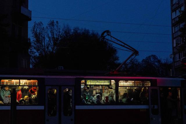 Local residents ride the tram in Kharkiv on October 20, 2026, amid the Russian invasion of Ukraine. (Photo by Tetiana DZHAFAROVA / AFP)