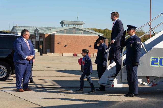 US Vice President JD Vance and his son Vivek exit Air Force Two, at Cincinnati/Northern Kentucky International Airport, in Hebron, Kentucky, on October 21, 2026. Vance is travelling to Ohio to attend a rally in support of gubernatorial candidate Vivek Ramaswamy. (Photo by Jacquelyn Martin / POOL / AFP)
