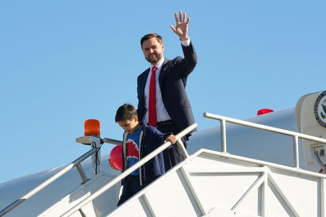 US Vice President JD Vance and his son Vivek exit Air Force Two, at Cincinnati/Northern Kentucky International Airport, in Hebron, Kentucky, on October 21, 2026. Vance is travelling to Ohio to attend a rally in support of gubernatorial candidate Vivek Ramaswamy. (Photo by Jacquelyn Martin / POOL / AFP)