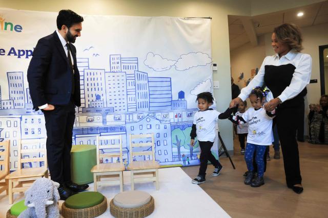 New York City Mayor Zohran Mamdani greets teachers and children as he visits The Little Apple child care center in New York on October 21, 2026. The Little Apple is New York City's first free child care pilot program for municipal employees and their families, in partnership with the City of New York. (Photo by Spencer Platt / POOL / AFP)