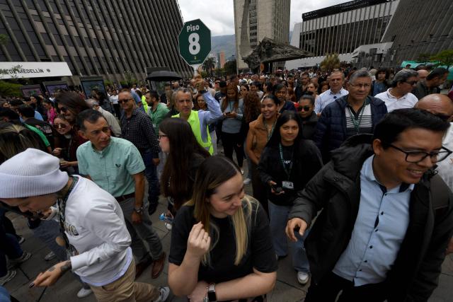 People take part in a nationwide earthquake preparedness drill in Medellin, Colombia, on October 21, 2026. (Photo by Jaime SALDARRIAGA / AFP)