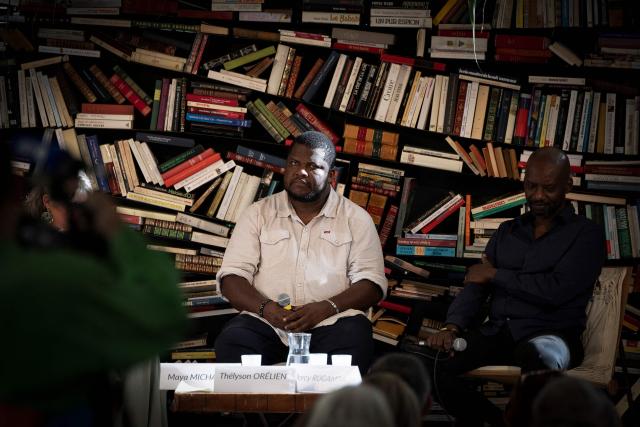 (FILES) Canadian-Haitian novelist Thelyson Orelien (L) and Rwandan author, dancer and stage director Dorcy Rugamba take part in the 28th edition of "Les Correspondances" literature festival in Manosque, south-eastern France on September 24, 2026. Canadian publisher Editions Boreal said on October 21, 2026 that novelist Orelien used AI to write novel, one week after announcing that is was keeping the novel in bookstores, asserting that it has no element making it possible to establish with certainty a recourse to artificial intelligence (AI) for its writing. (Photo by JOEL SAGET / AFP)