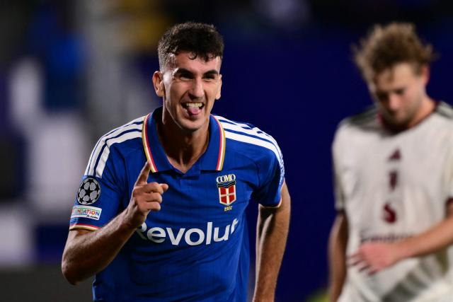Como's Spanish defender #04 Jacobo Ramon celebrates scoring his team's fourth goal during the UEFA Champions League, league phase matchday 3, football match between Como 1907 and Manchester United at the Stadio Giuseppe Sinigaglia in Como, northen Italy on October 21, 2026. (Photo by Marco BERTORELLO / AFP)