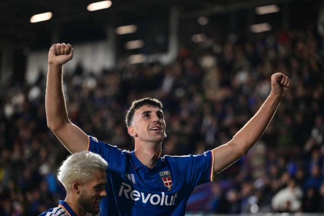 Como's Spanish defender #04 Jacobo Ramon celebrates scoring his team's fourth goal during the UEFA Champions League, league phase matchday 3, football match between Como 1907 and Manchester United at the Stadio Giuseppe Sinigaglia in Como, northen Italy on October 21, 2026. (Photo by Marco BERTORELLO / AFP)