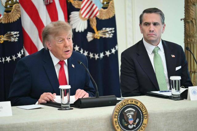 US President Donald Trump participates in a roundtable in the East Room of the White House in Washington, DC, on October 21, 2026, alongside US Attorney General Todd Blanche. (Photo by SAUL LOEB / AFP)