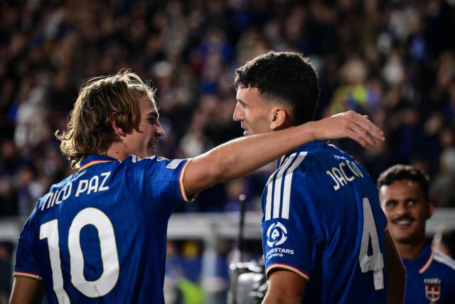Como's Spanish defender #04 Jacobo Ramon (R) celebrates scoring his team's fourth goal with Como's Argentine midfielder #10 Nicolas Paz (L) during the UEFA Champions League, league phase matchday 3, football match between Como 1907 and Manchester United at the Stadio Giuseppe Sinigaglia in Como, northen Italy on October 21, 2026. (Photo by Marco BERTORELLO / AFP)
