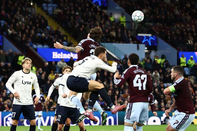 Aston Villa's Swedish defender #03 Victor Lindelof (C) heads the ball clear during the UEFA Champions League, league phase football match between Aston Villa and Viking at Villa Park in Birmingham, central England on October 21, 2026. (Photo by Henry Nicholls / AFP)