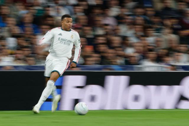 Real Madrid's French forward #10 Kylian Mbappe runs with the ball during their UEFA Champions League first round day 3 football match between Real Madrid CF and RB Leipzig at the Santiago Bernabeu stadium in Madrid on October 21, 2026. (Photo by Oscar DEL POZO / AFP)