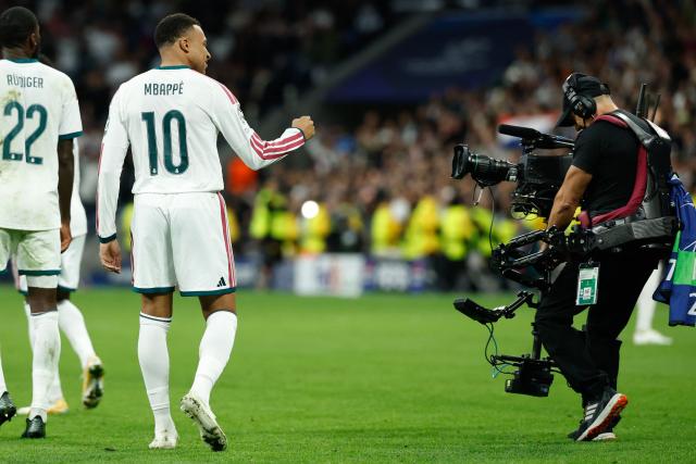 Real Madrid's French forward #10 Kylian Mbappe celebrates scoring his team's third goal during their UEFA Champions League first round day 3 football match between Real Madrid CF and RB Leipzig at the Santiago Bernabeu stadium in Madrid on October 21, 2026. (Photo by Oscar DEL POZO / AFP)