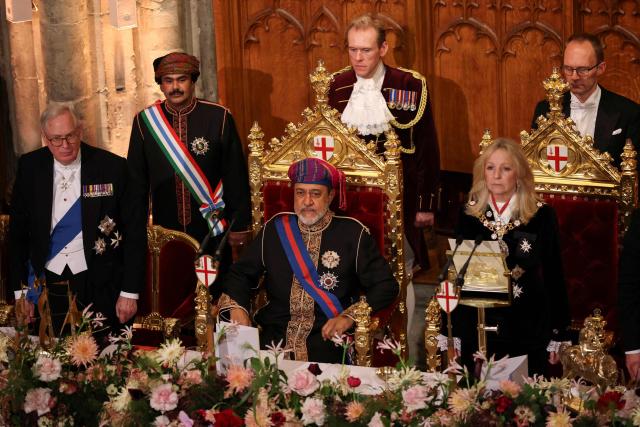 Oman's Sultan Haitham bin Tariq (C) listens to the Omani National Anthem beside Britain's Prince Richard, Duke of Gloucester (L) and City of London Lady Mayor, Susan Langley (R) during a State Banquet at The Guildhall in The City of London, on October 21, 2026, the second day of a three-day State Visit to the United Kingdom by The Sultan of Oman. (Photo by Isabel Infantes / POOL / AFP)