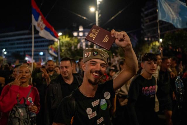 Students cheer and celebrate as they arrive in central Belgrade on October 21, 2026, after walking for several days to attend the student movement's final major rally, due to be held in the capital the following day, ahead of Serbia's October 25 snap elections. The student-led movement emerged from nationwide protests following the November 2024 collapse of a railway station canopy in Novi Sad that killed 16 people, with demands expanding to include early elections in May 2025. The student movement formally entered the electoral race in September, challenging the Serbian Progressive Party (SNS). (Photo by Andrej ISAKOVIC / AFP)