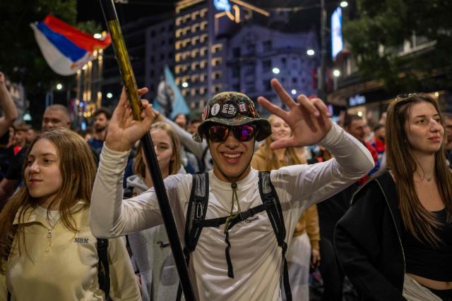 Students cheer and celebrate as they arrive in central Belgrade on October 21, 2026, after walking for several days to attend the student movement's final major rally, due to be held in the capital the following day, ahead of Serbia's October 25 snap elections. The student-led movement emerged from nationwide protests following the November 2024 collapse of a railway station canopy in Novi Sad that killed 16 people, with demands expanding to include early elections in May 2025. The student movement formally entered the electoral race in September, challenging the Serbian Progressive Party (SNS). (Photo by Andrej ISAKOVIC / AFP)