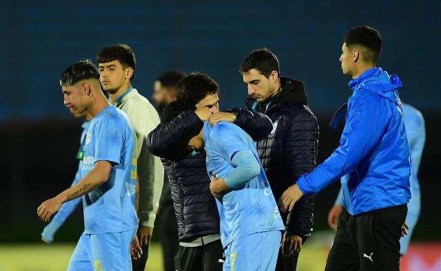 Montevideo City Torque's Argentine forward #07 Luka Andrade (C) is comforted by a teammate at the end of the Copa Sudamericana semifinal second leg football match between Uruguay's Montevideo City Torque and Brazil's Atletico Mineiro at the Centenario stadium in Montevideo on October 21, 2026. (Photo by Dante FERNANDEZ / AFP)