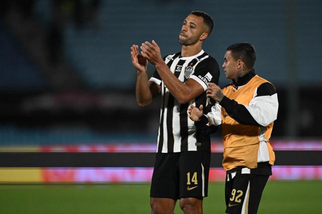 Atletico Mineiro's defender #14 Vitor Hugo and Atletico Mineiro's midfielder #92 Eduardo Pereira react at the end of the Copa Sudamericana semifinal second leg football match between Uruguay's Montevideo City Torque and Brazil's Atletico Mineiro at the Centenario stadium in Montevideo on October 21, 2026. (Photo by Eitan ABRAMOVICH / AFP)