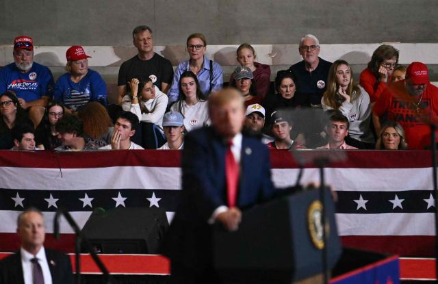 Attendees listen to US President Donald Trump speak during a campaign rally at T. Ed Garrison Arena in Pendleton, South Carolina on October 21, 2026. (Photo by Kent NISHIMURA / AFP)