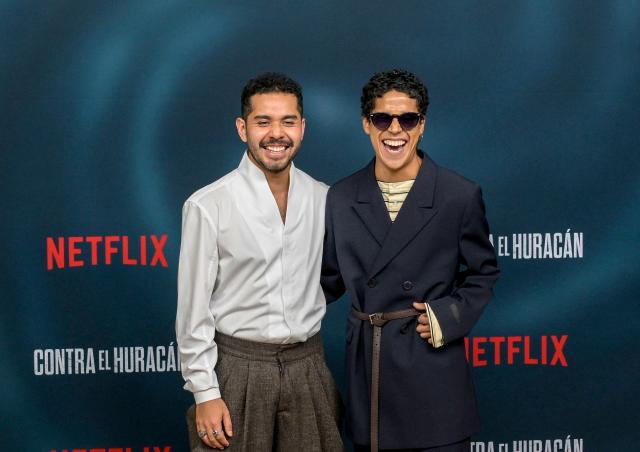 Mexican actors Kristyan Ferrer and Benny Emmanuel pose on the red carpet for the Mexican film "Contra el Huracan" (Against the Hurricane) at Plaza Antara in Mexico City on October 21, 2026. The film "Against the Hurricane" is based on the story of two survivors of Hurricane Otis, which hit Acapulco in October 2023. (Photo by Alfredo ESTRELLA / AFP)