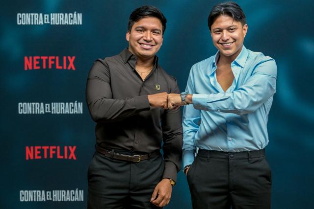 Hurricane Otis survivors Jonathan Chino and Marlon Valdez, whose story inspired the film "Contra el Huracan" (Against the Hurricane), pose on the red carpet at Plaza Antara in Mexico City on October 21, 2026. The film "Against the Hurricane" is based on the story of two survivors of Hurricane Otis, which hit Acapulco in October 2023. (Photo by Alfredo ESTRELLA / AFP)