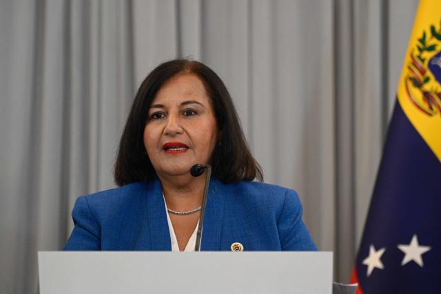 Opposition delegation head Dinorah Figuera delivers a joint statement following the signing of an agreement at the closing of the third round of political dialogue talks at the Melia Hotel in Caracas on October 21, 2026. Venezuela's interim government and the opposition on Wednesday reaffirmed their commitment to holding presidential elections in the country under Washington-backed talks, the opposition said after a third round of negotiations. (Photo by Federico PARRA / AFP)